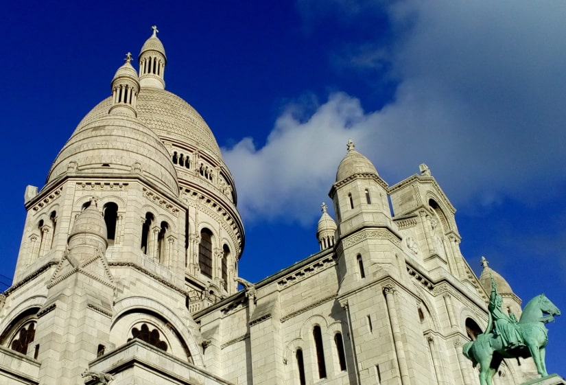 A detail of the dome of the Sacré Coeur Basilica Montmartre. Bright blue sky in background.