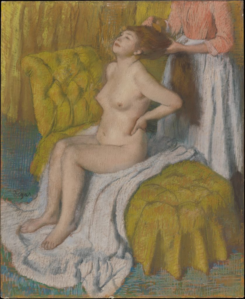 Edgar Degas. Woman Having her Hair Combed. A naked woman sits on a white towel on a padded chair. She is having her long auburn hair combed by a maid behind her. The woman's head is lifted and she digs her hand into her flank to brace herself against the combing. We see the woman's face in a three-quarter frontal view.